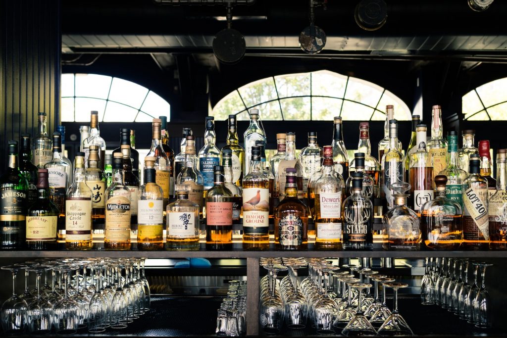 assorted liquor bottles on table