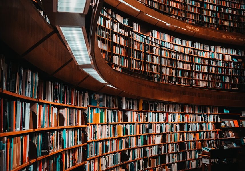 photo of brown wooden bookshelf