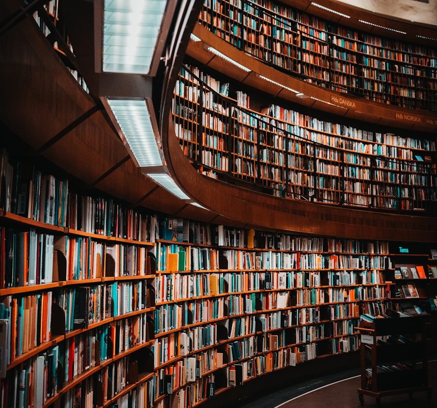 photo of brown wooden bookshelf