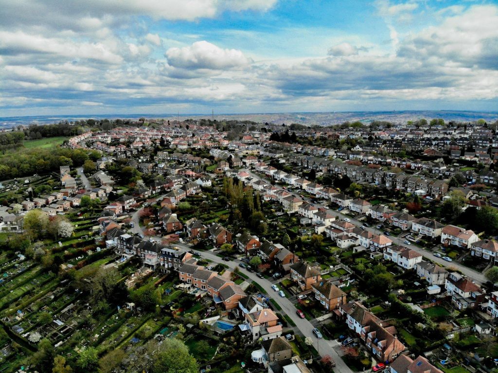 an aerial view of a city with lots of houses